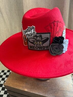 red cowboy hat meowdy patched up branded and flowers
